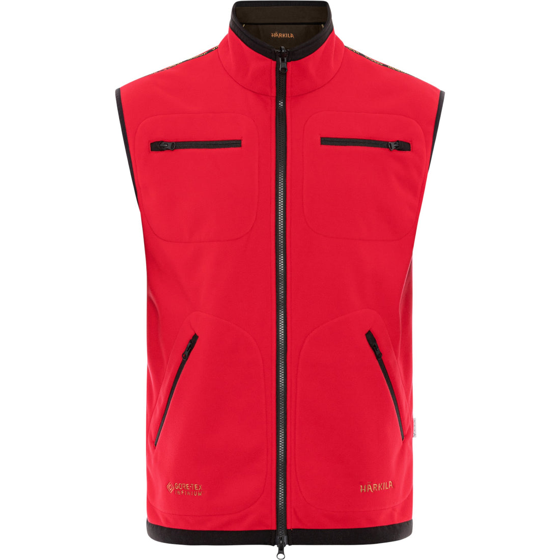 Vista frontal de la cara roja del chaleco reversible Härkila Kamko con cuatro bolsillos.